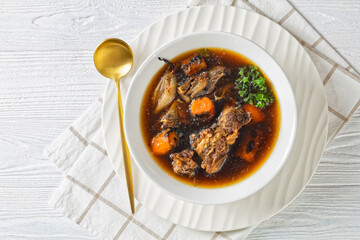 Canvas Print - beef broth of beef meat on bones with veggies