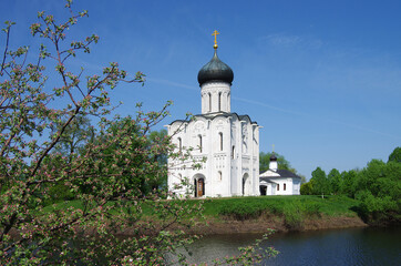 Wall Mural - Russia, Bogolyubovo - May, 2021: Church of the Intercession on the Nerl. Orthodox church and a symbol of medieval Russia, Vladimir region