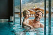 © Mareen Fischinger/Westend61 - Smiling father with son enjoying in infinity pool at hotel
