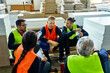 © Dangubic/Westend61 - Workers in factory having lunch break together