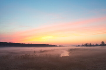 Wall Mural - morning fog over the river red dawn