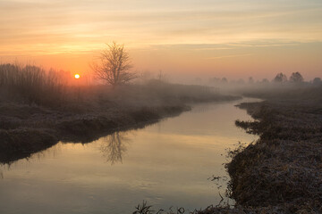 Wall Mural - morning fog over the river red dawn