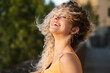 © Mikel Taboada/Westend61 - Young woman laughing outdoors