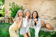 © peter scholl/Westend61 - Portrait of three excited women of different age cheering