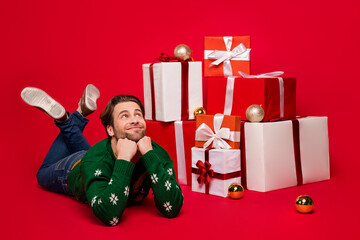 Poster - Full size photo of young guy happy positive smile dream look empty space eve time celebrate isolated over red color background