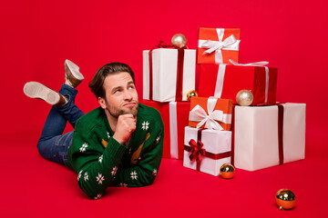 Poster - Full length body size photo man laying on floor looking copyspace dreaming about presents isolated vivid red color background