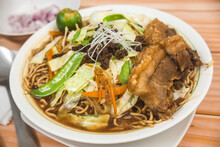 Pancit Cabagan, A Dish Originating From Isabela, Philippines. Stir Fried Noodles Soaked In Sauce, Topped With Vegetables And Pork.