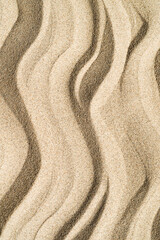 minimalistic vertical textured sand art background with waves