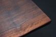 © Evgenii Starkov - Style wooden countertop slab, saw cut wood treated with varnish close-up on black. Isolate.
