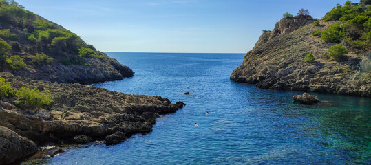 Panoramic photo of Calo des Monjo beach in Mallorca. Beautiful view of the  seacoast of  Mallorca with an amazing turquoise sea, in the middle of the nature. Concept of summer, travel, relax and enjoy