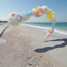 Render Of A Surreal Reflective Bubble Curve On The Beach