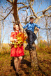 © keleny - Mother and adult son in autumn park or forest in sunny day. Happy family walking outdoors