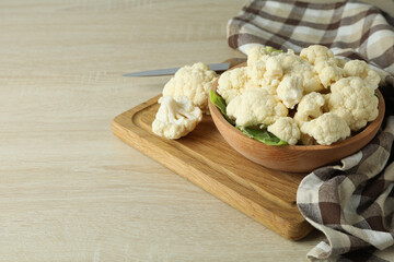 Wall Mural - Concept of tasty food with cauliflower on wooden background