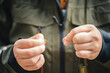 Close up of young fisherman's hands tying a Fly Fishing Knot. Fly fishing concept.