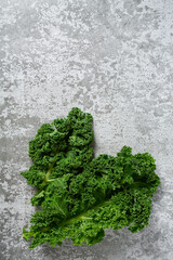 Wall Mural - kale cabbage on grey stone surface