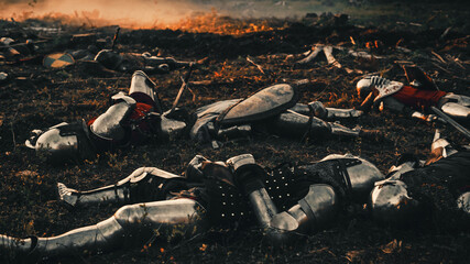 After Epic Battle Bodies of Dead, Massacred Medieval Knights Lying on Battlefield. Warrior Soldiers Fallen in Conflict, War, Conquest, Warfare, Colonization. Cinematic Dramatic Historical Reenactment