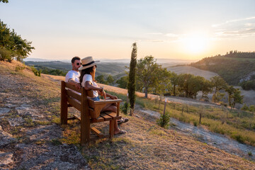 Wall Mural - Tuscany Italy, Perfect Road Avenue through cypress trees ideal Tuscan landscape Italy, couple man and woman on vacation in Toscane, couple man and woman in the hills of Toscany