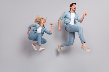 Sticker - Full length body size view of beautiful handsome friends friendship jumping running isolated over grey pastel color background