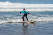 © Image'in - cute little girl taking a surf lesson