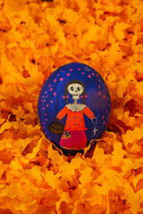 Poster - Hand-painted canary eggs with details of Catrinas from Day of the Dead, a traditional Mexican holiday, these ornaments are placed on the altars of the dead with an orange confetti background.