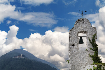 Poster - Old bell tower with Cerro de Guadalupe in the background in Bogota, Colombia