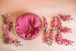 © Mila - pink flowers petals on wooden background