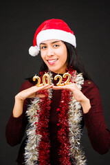 Sticker - 2022 number, new year celebration latin young woman with santa hat. happy new year.