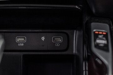 Car USB slots. 12 Voltage outlet. Wireless charger indicator.