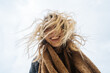 © Pietro Karras/Stocksy - Happy woman with messy hair smiling