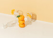 © Sophia Hsin/Stocksy - Stack of mandarin oranges with glassware