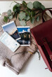 © Sergey Narevskih/Stocksy - Accessories for travelling concept arranged on table