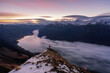 © plpictures by Paedii Luchs/Stocksy - One man standing on cliff in mountainous landsacpe.