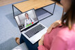 © Andrey Popov - Pregnant Women Doctor Video Call On Laptop