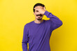 © luismolinero - Young caucasian man isolated on yellow background covering eyes by hands and smiling