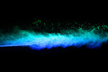 Wall Mural - abstract blue powder splatted background,Freeze motion of color powder exploding/throwing color powder,color glitter texture on black background.