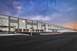 © Brian - Modern warehouse distribution center at sunset
