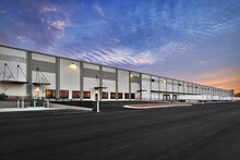 Modern Warehouse Distribution Center At Sunset