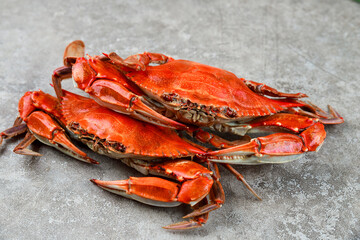 Wall Mural - Boiled crabs on wooden background. Seafood menu.