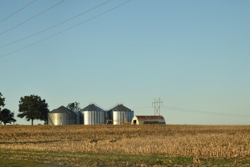 Poster - Grain Bins and a Barn in a Field