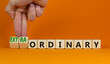 © Dzmitry - Ordinary or extraordinary symbol. Businessman turnes wooden cubes and changes words 'Ordinary extraordinary'. Beautiful orange background. Business, ordinary or extraordinary concept. Copy space.