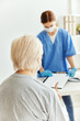 © SHOTPRIME STUDIO - elderly woman and doctor examination medical masks