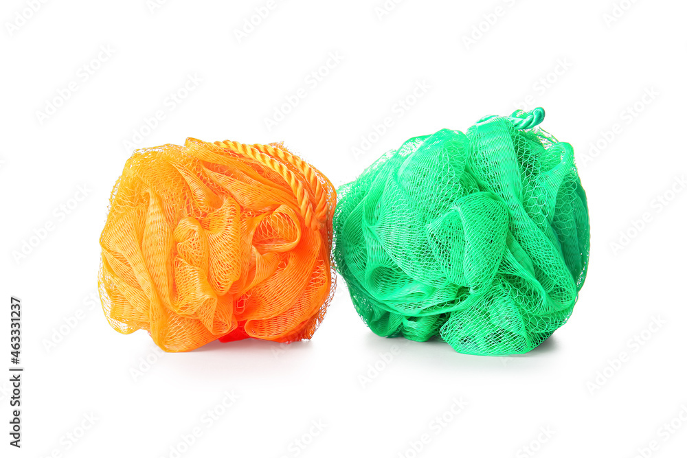 Colorful bath sponges isolated on white background