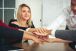 © amorn - Group of business people join hand together, Business team putting their hands