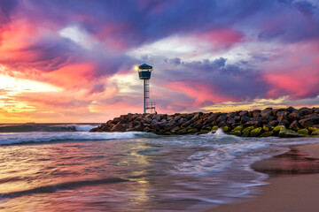 Wall Mural - City Beach, Perth. Sunset at jetty with light beacon. Motion blur water.