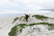 © Marc Romanelli - young boy exploring rocky coastline, Grotto Beach, Hermanus, South Africa