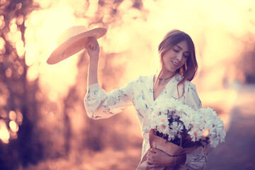 Wall Mural - girl in a straw hat portrait spring freedom / concept spring view model happy people