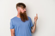 © Asier - Young caucasian ginger man with long beard isolated on white background pointing with finger at you as if inviting come closer.