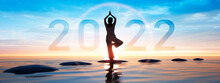 Silhouette Of A Woman And Numbers 2022 Concept In  Sunset Sky And Sea Background