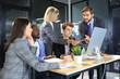 © ty - Group of business people in a meeting discussing and planning a project.