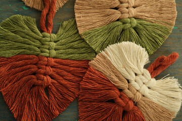 Close-up leaf macrame made of colored threads.